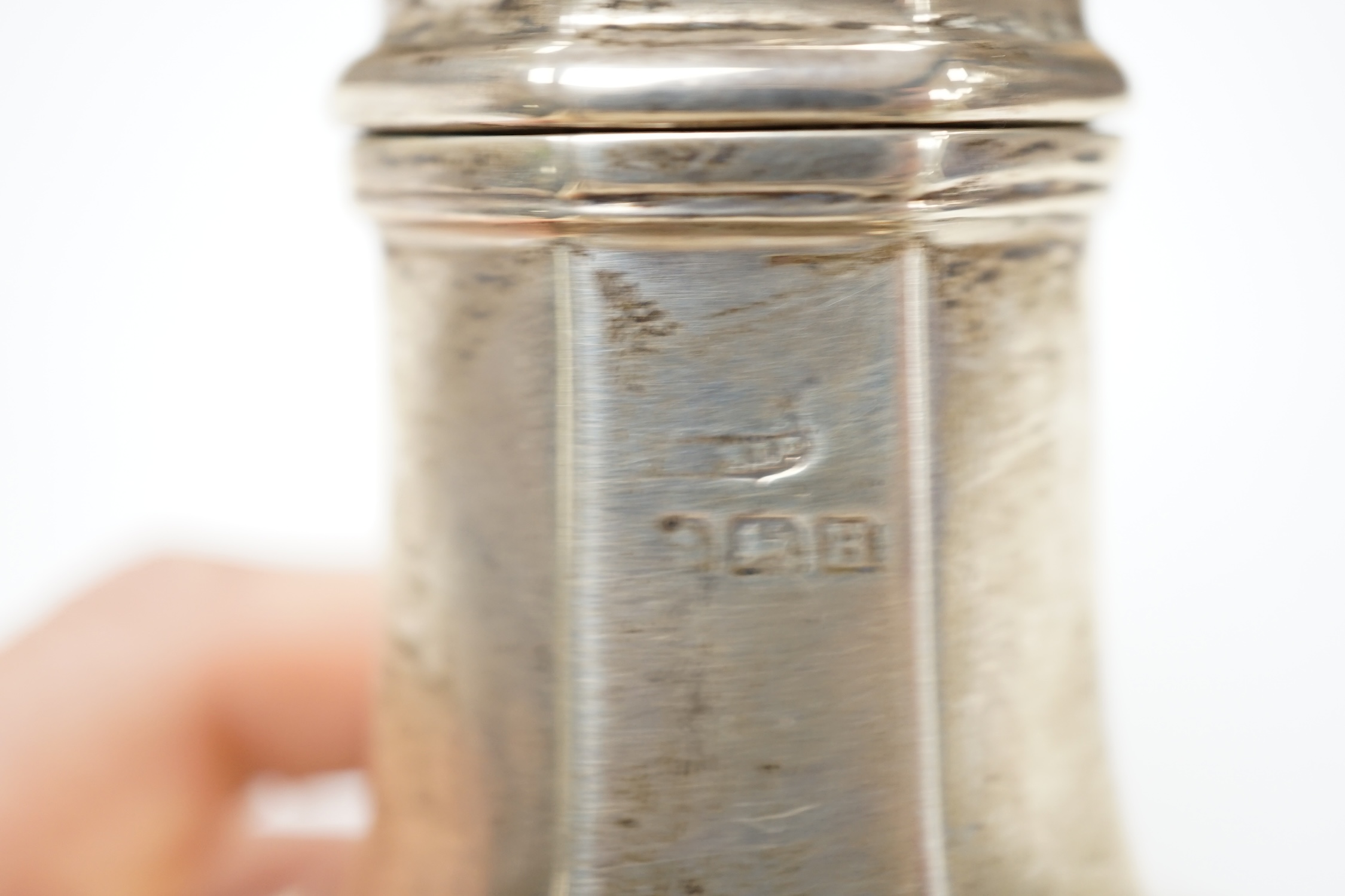 A George V silver octagonal sugar caster, Birmingham, 1932, 18.1cm, 4.7oz. Condition - poor to fair